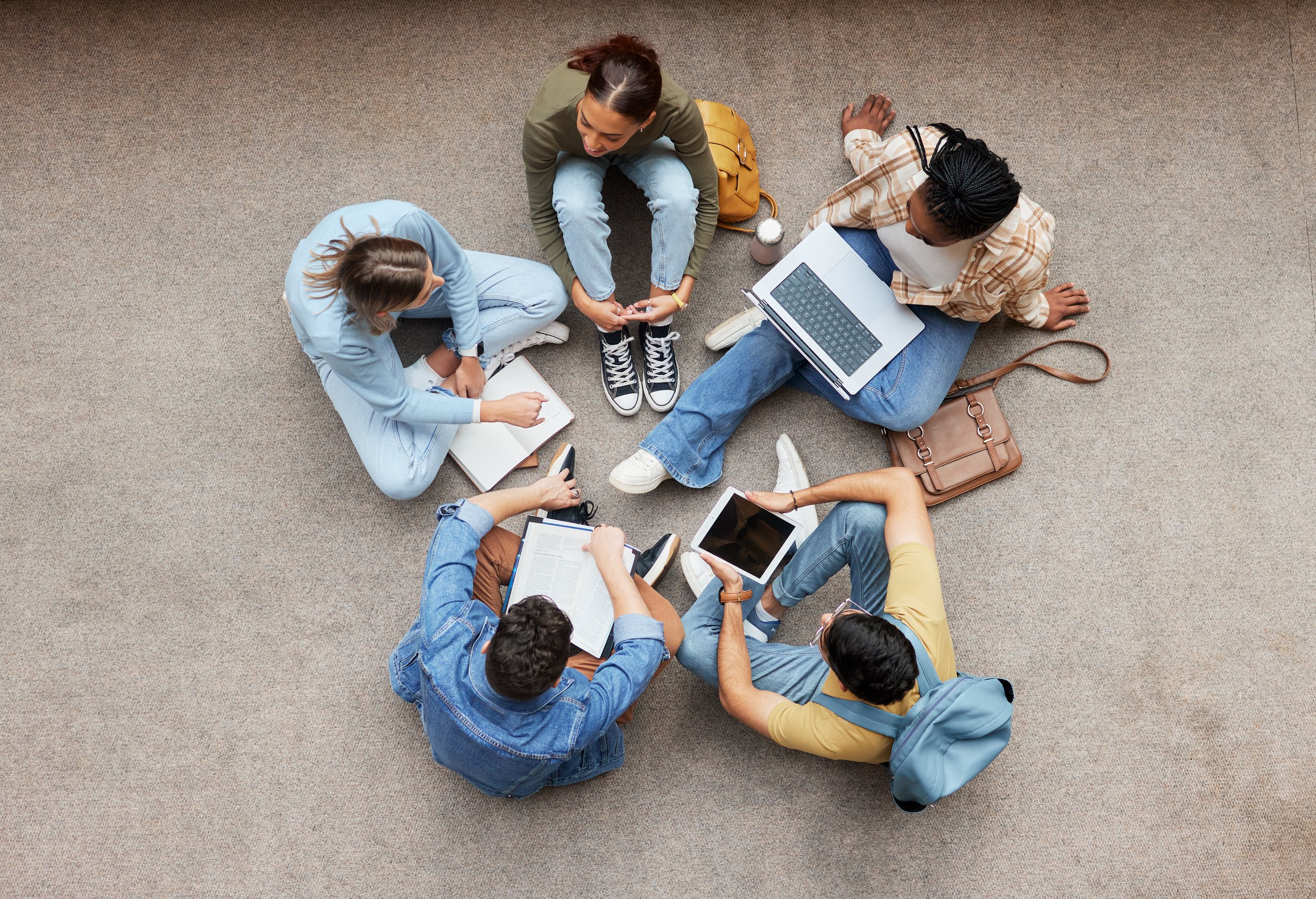 students working together on the floor